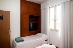 TV a/nebo společenská místnost v ubytování American Hostel e Pousada