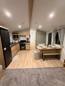 a large kitchen with a table in a room at St Marys View in Whitley Bay