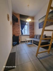 Ένα ή περισσότερα κρεβάτια σε δωμάτιο στο ROOMS and MORE CITY of Katowice