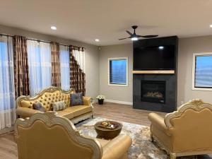 a living room with two couches and a fireplace at 1st Luxury Residential Elevator rooftop deck in Rochester