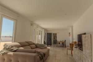 a living room with a couch and a table at Villa Mare in Teguise