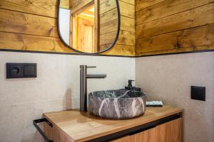 a bathroom with a sink and a mirror at El Freginal in Olocau del Rey +38 photos