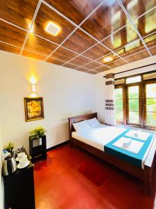 Giường trong phòng chung tại Sigiriya Arecanut Garden