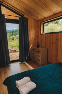 Postel nebo postele na pokoji v ubytování Chill&Heal, Либохора - будинки в горах, відпочинок в Карпатах, чан + 27 fotografií