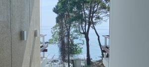 a view of the ocean from a building at Pebble Lanta - Seaview Stay in Ko Lanta