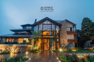 an image of a house with glass doors at 249 DESIGN HOTEL in Gramado