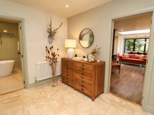 a living room with a dresser and a living room at Fairview in Saxmundham +43 photos