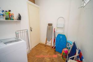 Ένα ή περισσότερα κρεβάτια σε δωμάτιο στο Apartamento no Guaruja 50m da Praia das Pitangueiras