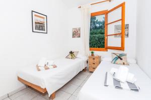 En eller flere senge i et værelse på Villa Gum + 15 billeder