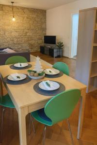 a wooden table with plates of food on it at Cool and Laidback at Sankt Johann in Basel