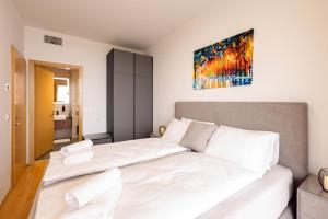 En eller flere senge i et værelse på Apartma Masada