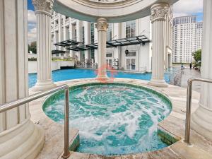 a hot tub in the middle of a building at Strategic 1BR Bellezza Apt Green Gem Max 6 in Jakarta