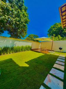 En have udenfor Casa em Itaúna - Saquaribe