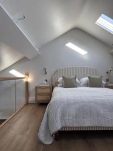 a bedroom with a large bed in a attic at Luxury Apartment in Shropshire sleeps 4 in Shrewsbury +29 photos