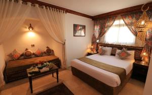 a hotel room with two beds and a window at Oriental Rivoli Hotel & Spa in Sharm El Sheikh +55 photos
