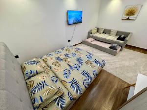 a living room with a couch at Luxury Private Room near airport in Abu Dhabi