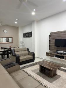 TV a/nebo společenská místnost v ubytování Inaz Homestay Alor Setar