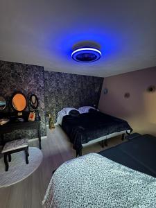 En eller flere senge i et værelse på L'instant pause douceur