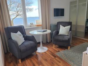 Χώρος καθιστικού στο Haus Achtern Diek in erster Reihe am Meer