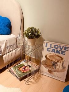 a cage on the floor with a book on it at 아늑하고 조용한 신축 숙소 Stay Hyun301 in Seoul
