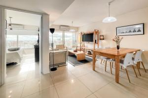 a dining room and living room with a table at San Telmo Suites 12 in Buenos Aires