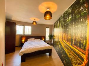 En eller flere senge i et værelse på Luxe vakantiehuis Drenthe 10 pers Hottub