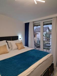 Giường trong phòng chung tại Apartman Savić