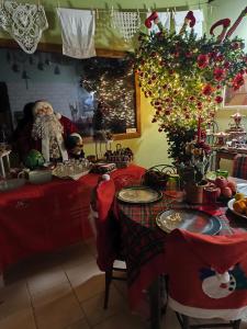 a room with a table with christmas decorations at Antica Masseria Il Casone in Candela