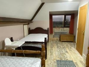 Voodi või voodid majutusasutuse Bungalow in Badsey, north of Cotswolds toas