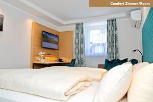 Ένα ή περισσότερα κρεβάτια σε δωμάτιο στο Hotel Zur Post +20 φωτογραφίες