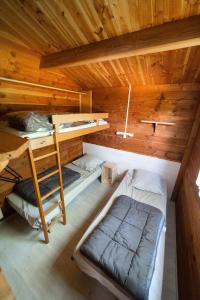 Кровать или кровати в номере Chalet prestige 13 piscine partagée