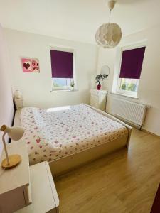 Ένα ή περισσότερα κρεβάτια σε δωμάτιο στο Fenix Haus