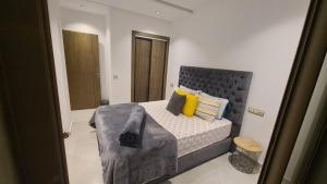 Una cama o camas en una habitación de Appartement sans vis-à-vis