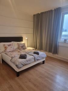 Ένα ή περισσότερα κρεβάτια σε δωμάτιο στο Rentalux Hostel - private dormitory and double rooms for 10 guests