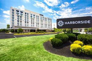 a hotel sign in front of a building at Harborside Hotel in Oxon Hill