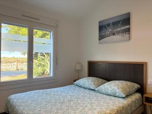 En eller flere senge i et værelse på Maison Gekko