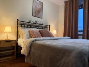 Ένα ή περισσότερα κρεβάτια σε δωμάτιο στο Home Boutique Hotel