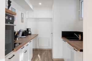 Η κουζίνα ή μικρή κουζίνα στο Au pied du Clocher - Centre ville