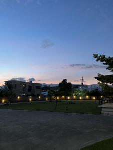 a building with lights in a park at night at 三五八民宿 in Taitung City +56 photos