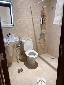 a bathroom with a shower and a toilet and a sink at Luxury 1BHK Private Apartment in Bosher in Muscat