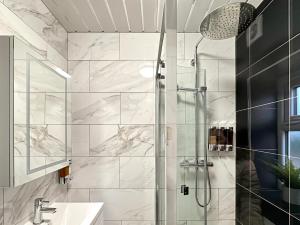 a bathroom with a shower and a sink at Granada Apartments Holmfield Rd in Blackpool +87 photos