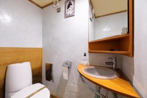 a small bathroom with a toilet and a sink at Ca Se Predine by Rentallorca in Alcudia +35 photos