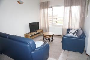 Posezení v ubytování Kustverhuur, Oude manege Nieuwvliet, Nieuwvliet 11