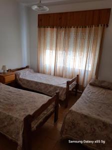 Ένα ή περισσότερα κρεβάτια σε δωμάτιο στο los nonis