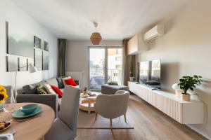 a living room with a couch and a table at Żurawie 231 in Gdańsk