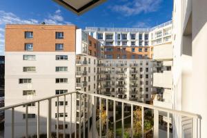 an apartment balcony with a view of a building at Żurawie 231 in Gdańsk