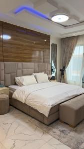a bedroom with a large bed in a room at Ocube Shortlet in Mama