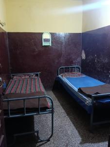 Ένα ή περισσότερα κρεβάτια σε δωμάτιο στο Sundar lodge