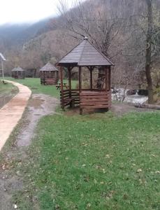 a park with a gazebo in the grass at Sljivik in Niš +16 photos