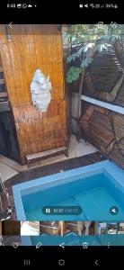 an overhead view of a swimming pool with a towel at Las cabañas in Tulum